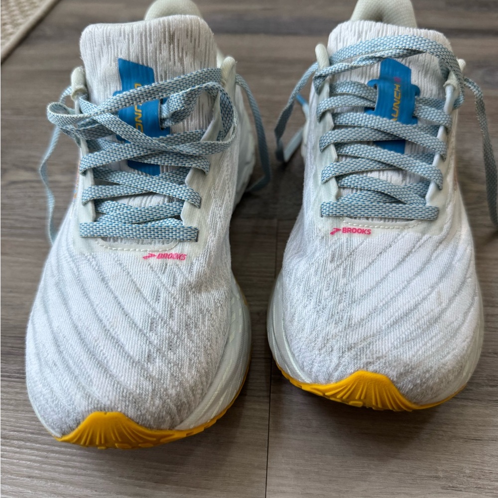 Brooks Launch 11 White Athletic Sneakers with Blue Laces and Yellow Toe Accents